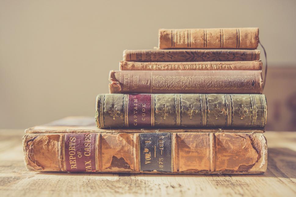 Free Image of Stack of vintage old books on table 