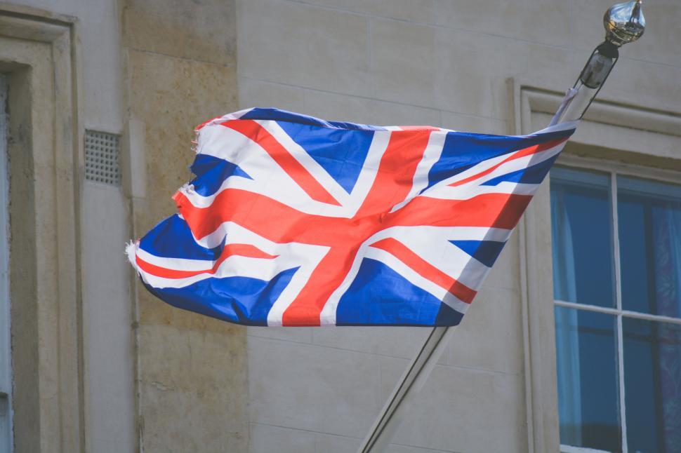 Free Image of Waving UK Union Jack flag on pole 