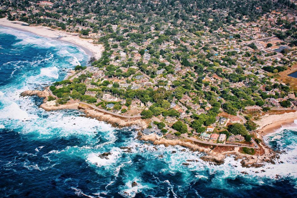 Free Image of Coastal village aerial view with rough sea 