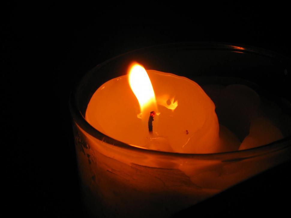Free Image of Lit Candle in Glass Bowl on Table 