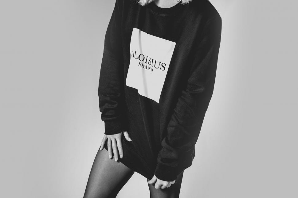 Free Image of Model in black sweater with logo design 