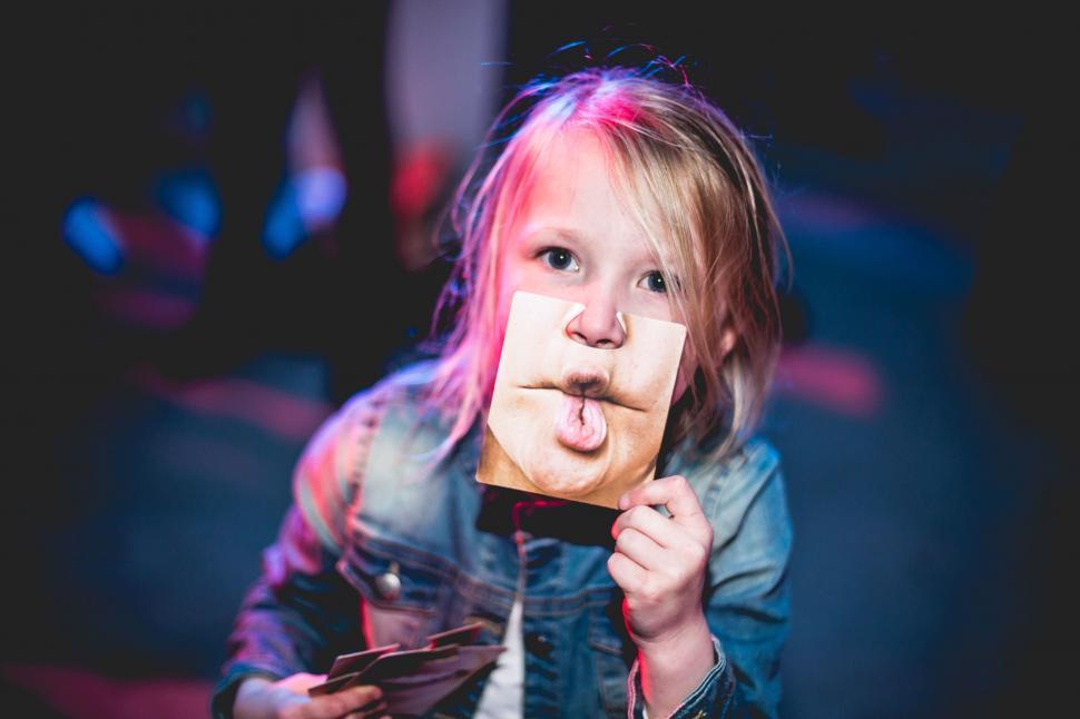 Free Image of Child with tongue-face paper mask 