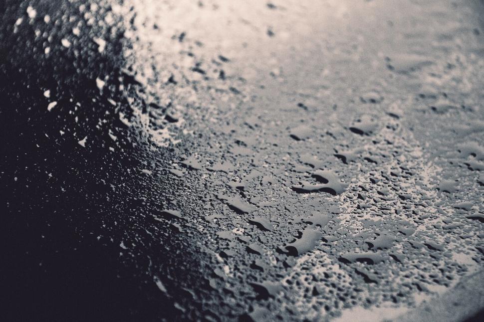 Free Image of Wet texture of water drops on dark surface 