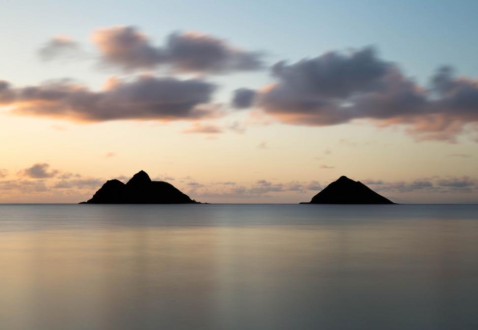 Free Image of Serene twin islands in golden sunset hues 