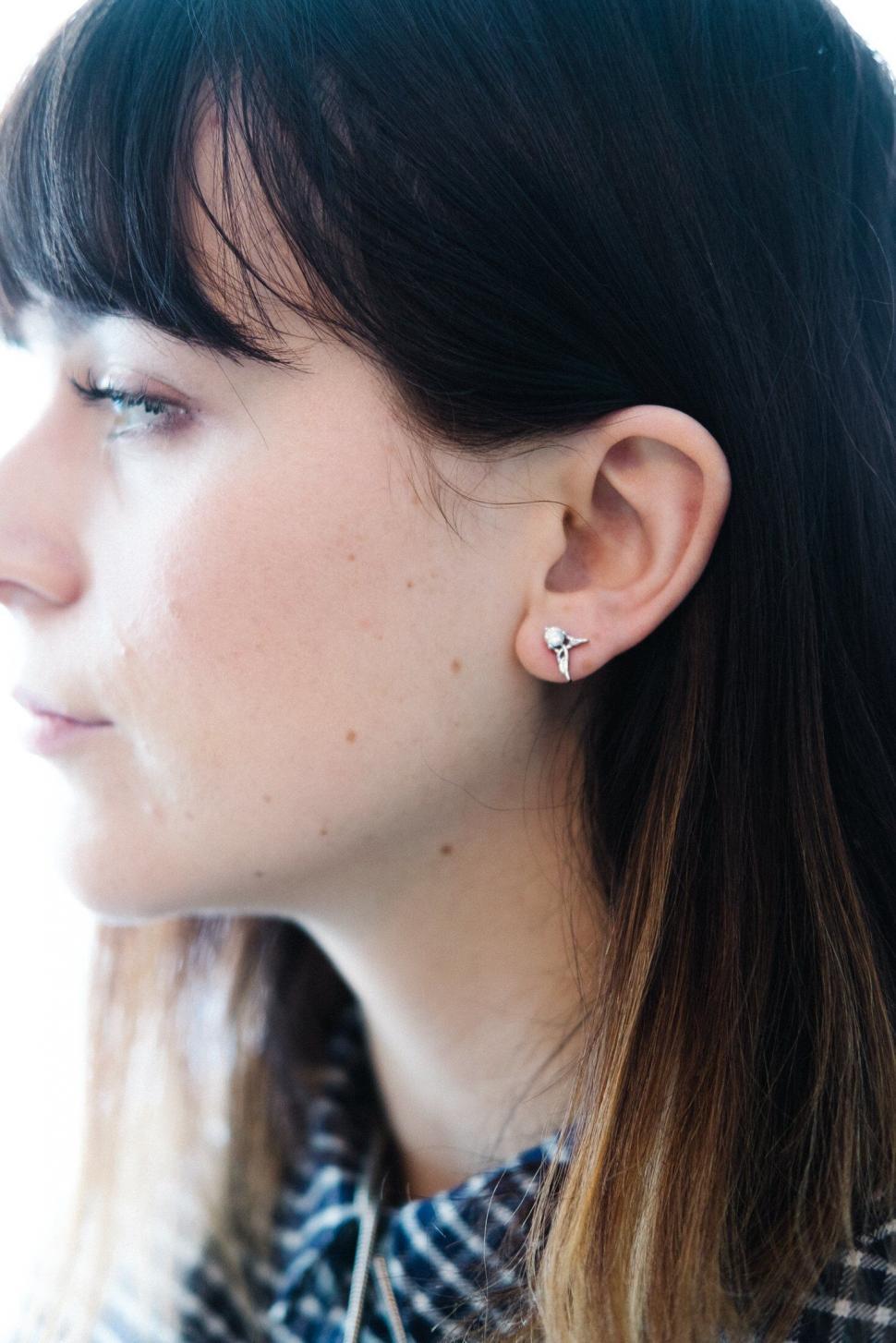 Free Image of Close-up of woman s ear with earring 