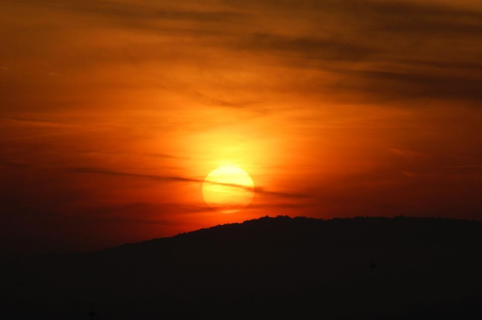 Free Image of Sunset over mountain silhouette 