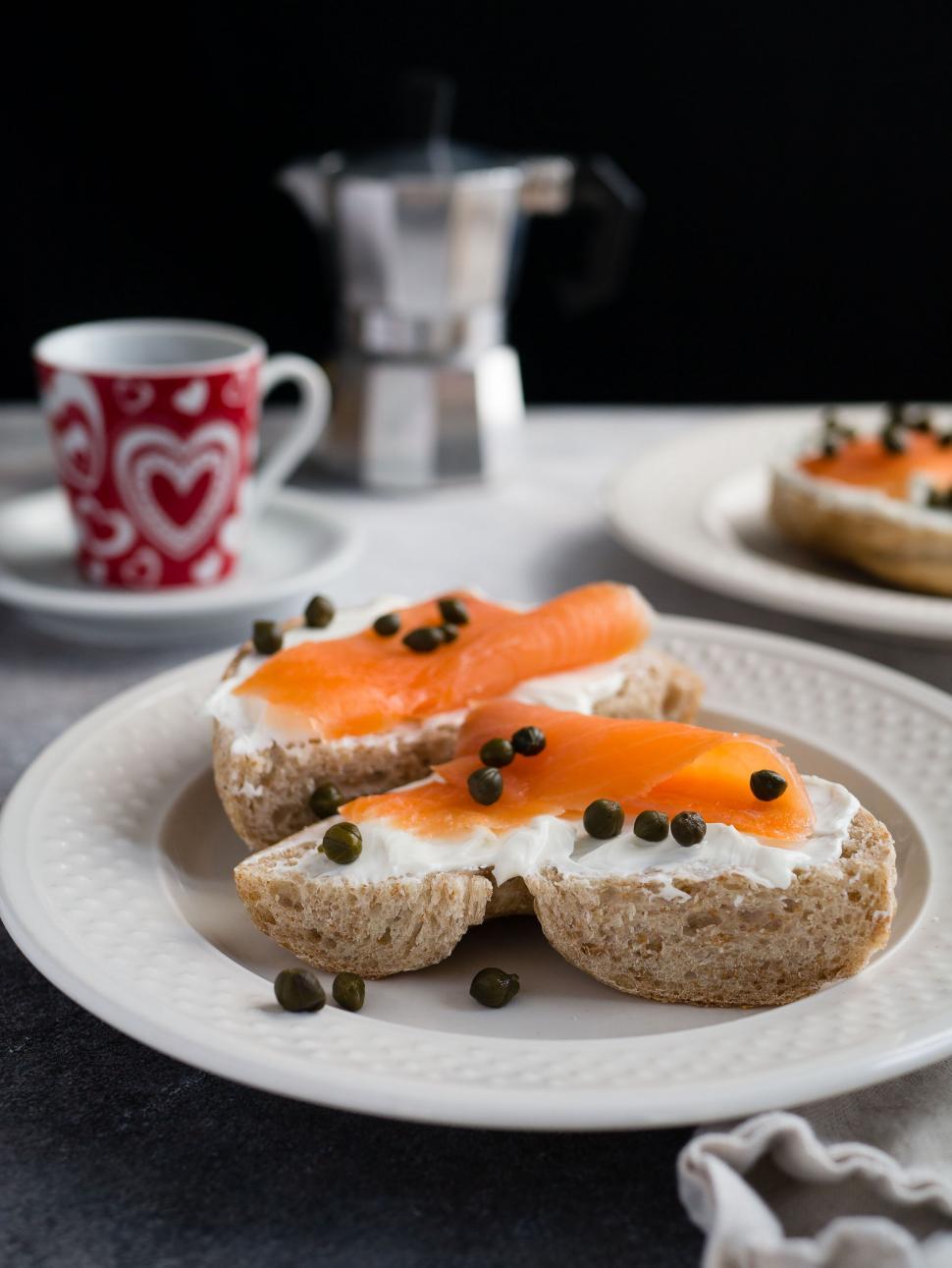 Free Image of Gourmet salmon bagels on elegant tableware 