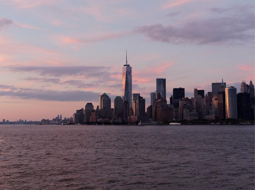 Free Image of New York City skyline at dusk with water 