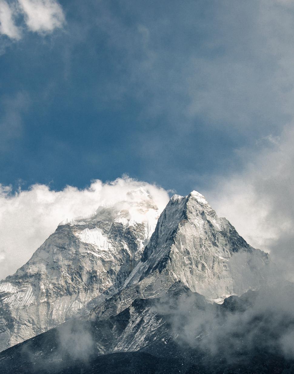 Free Image of Majestic mountain peak piercing the clouds 