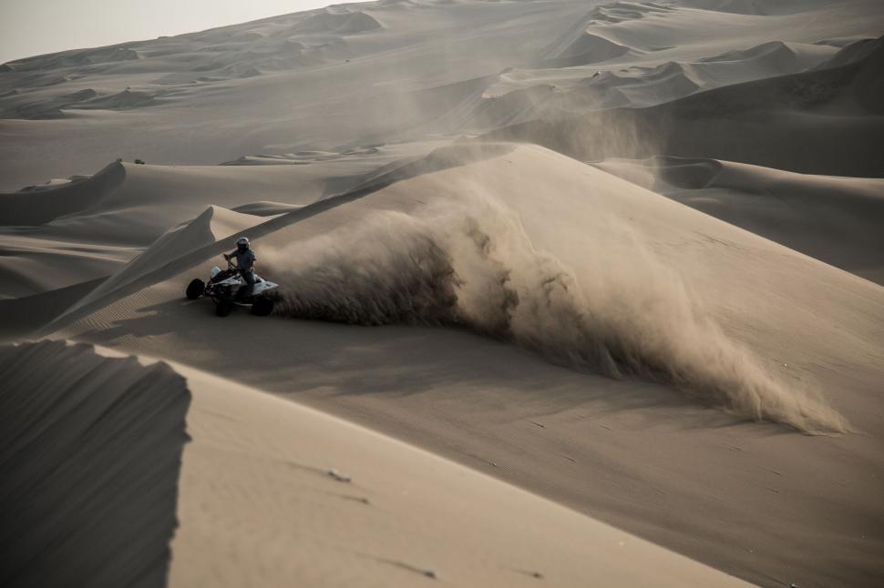 Free Image of Desert dune biking adventure in sandy terrain 