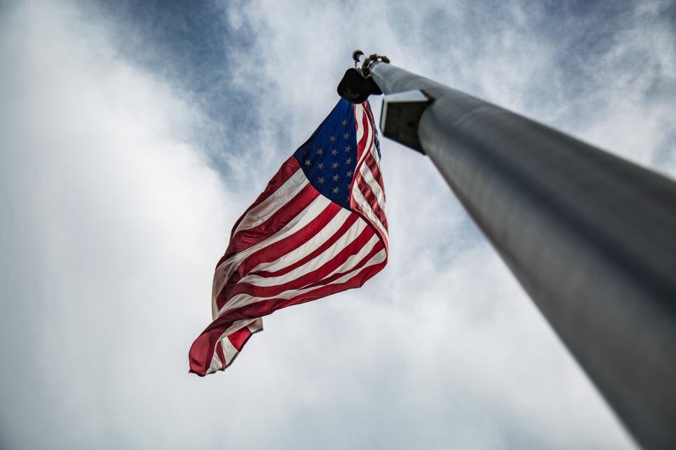 Free Image of American flag waving against sky backdrop 