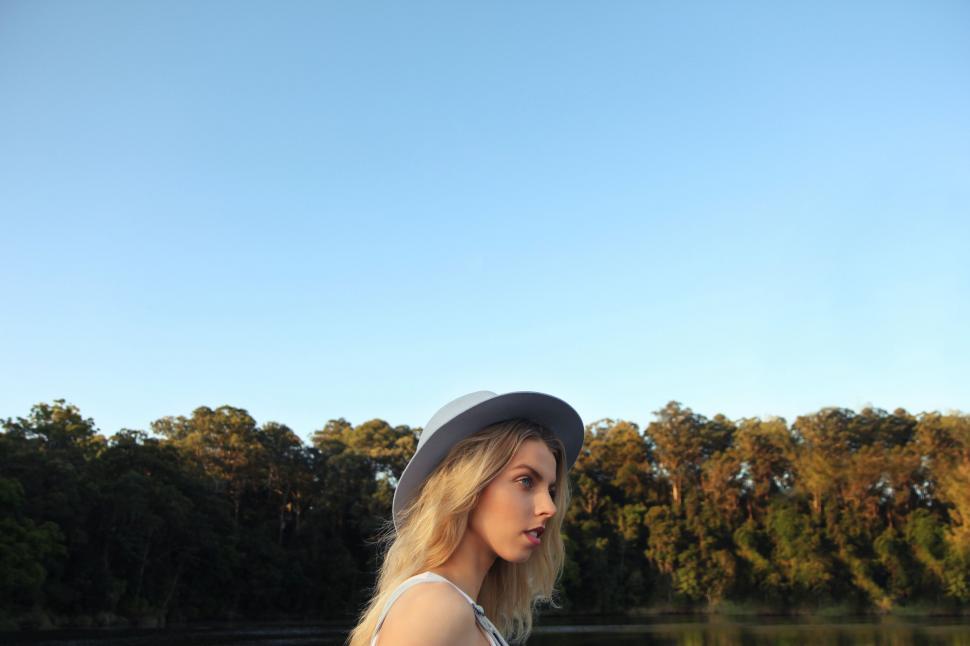 Free Image of Woman wearing hat in a natural landscape 