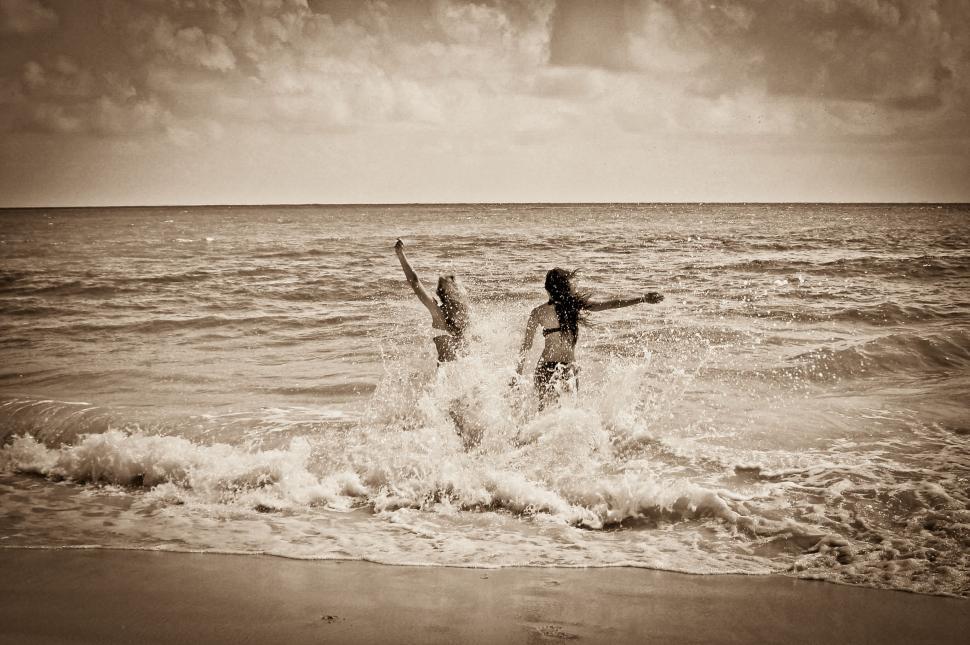 Free Image of Vintage sepia photo of people in sea 