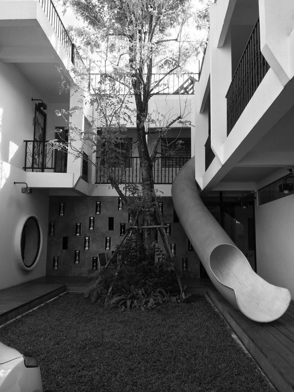 Free Image of Black and white photo of apartment with slide 