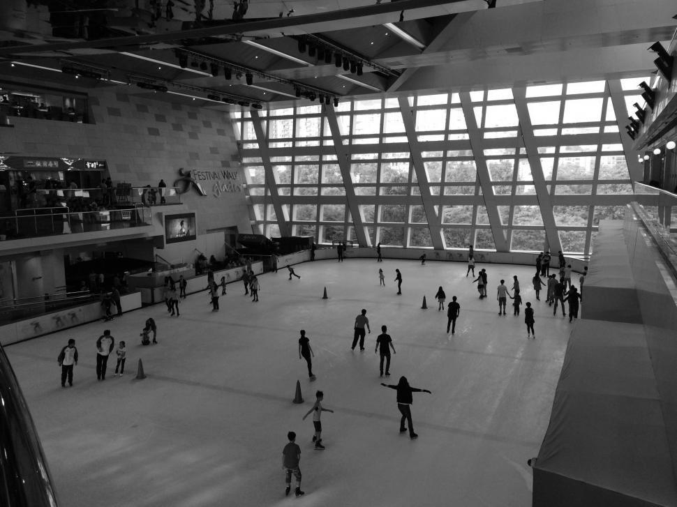 Free Image of Indoor ice skating rink with skaters 