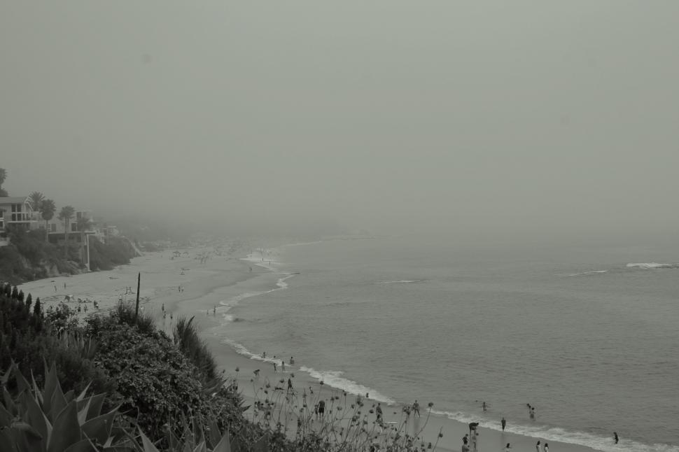 Free Image of Overcast coastline with beach and cliffs 