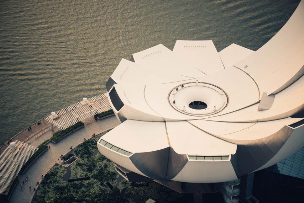 Free Image of Aerial view of unique flower-shaped building 