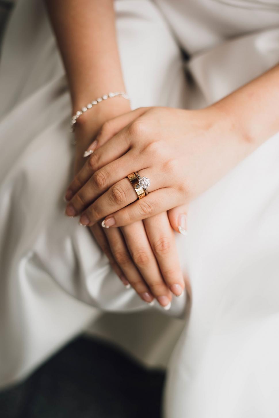 Free Image of Elegant bridal hands with diamond ring 
