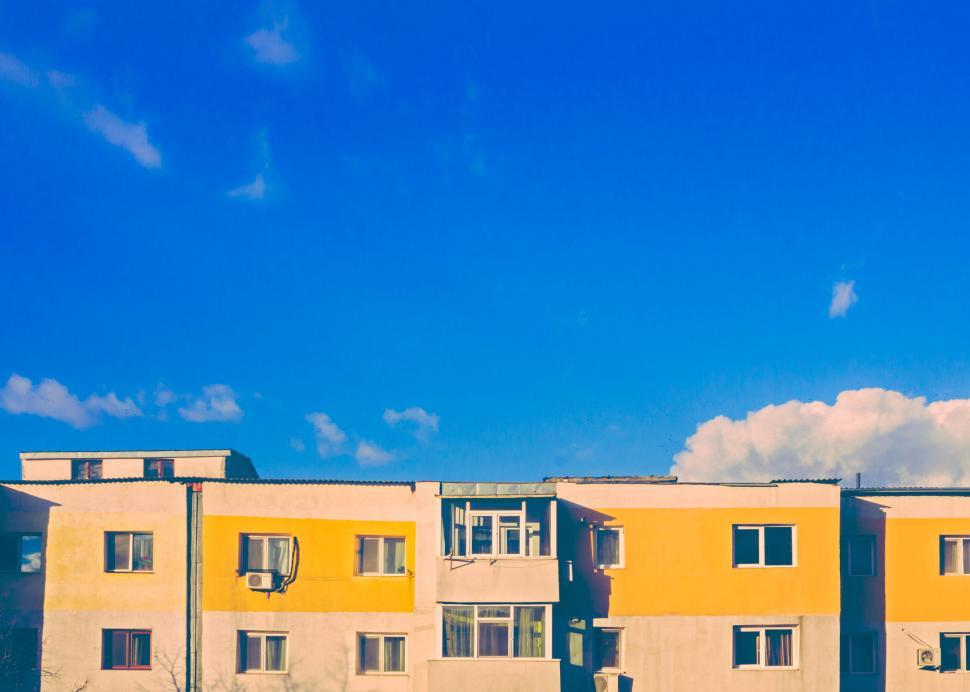 Free Image of Colorful apartment buildings under blue sky 