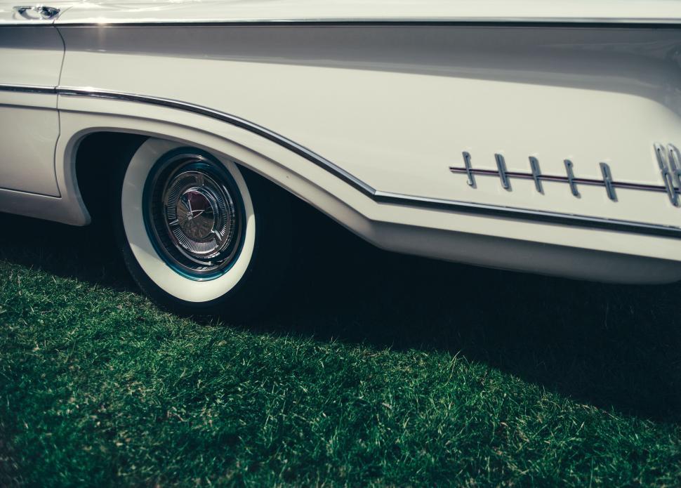Free Image of Vintage car side detail on grass 