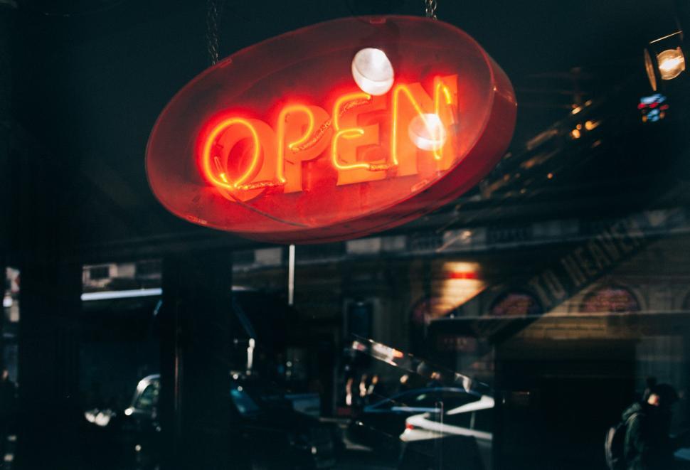 Free Image of Neon Open Sign Reflected on Glass 