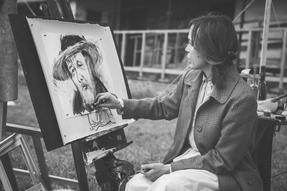 Free Image of Artist painting a portrait outdoors 