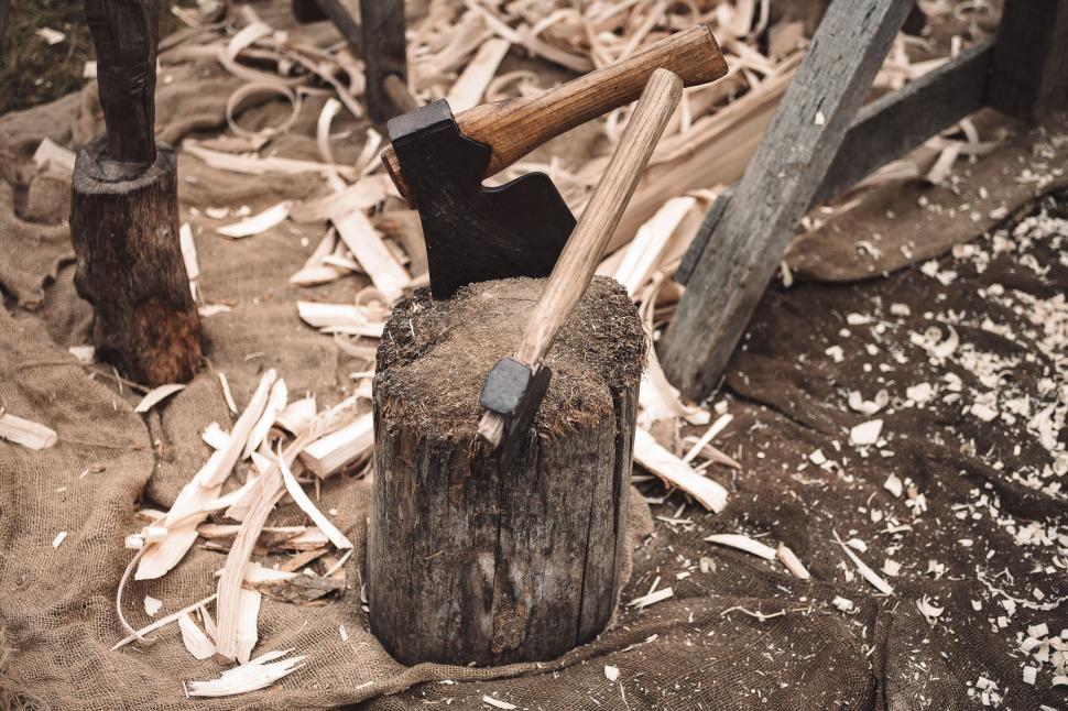 Free Image of Vintage axe embedded in a chopping block 
