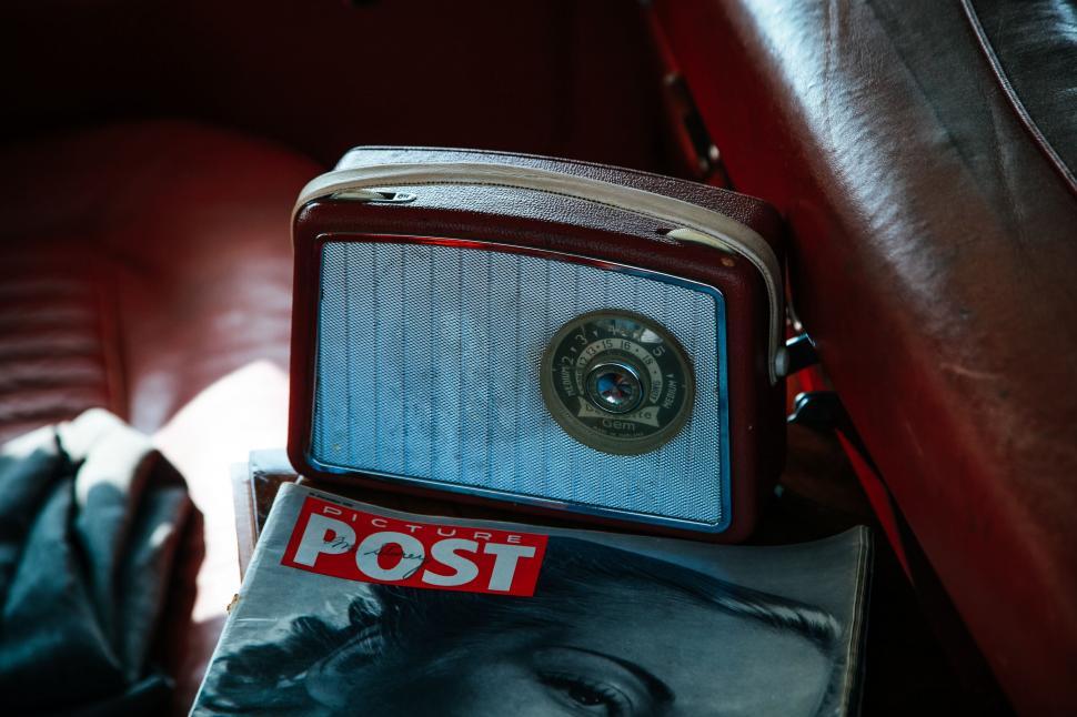 Free Image of Classic radio and magazine inside vintage car 
