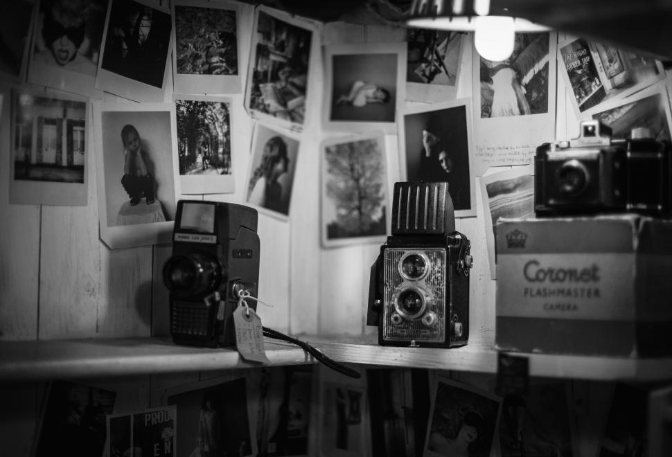 Free Image of Vintage cameras and photos on display 