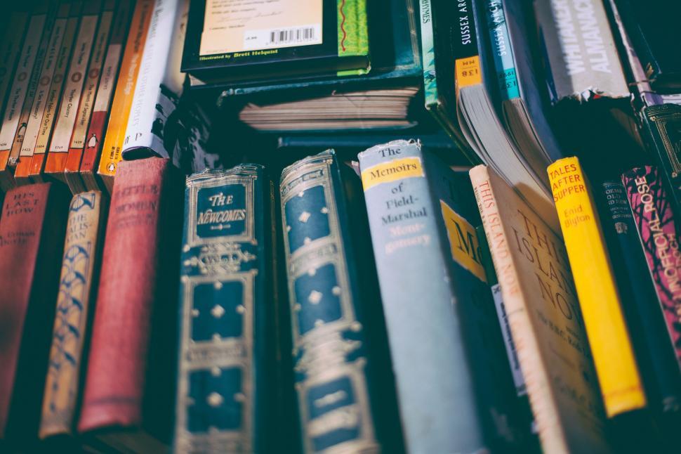 Free Image of Antique books on a shelf in a library 