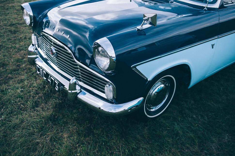 Free Image of Vintage car showcased at a sunny field 