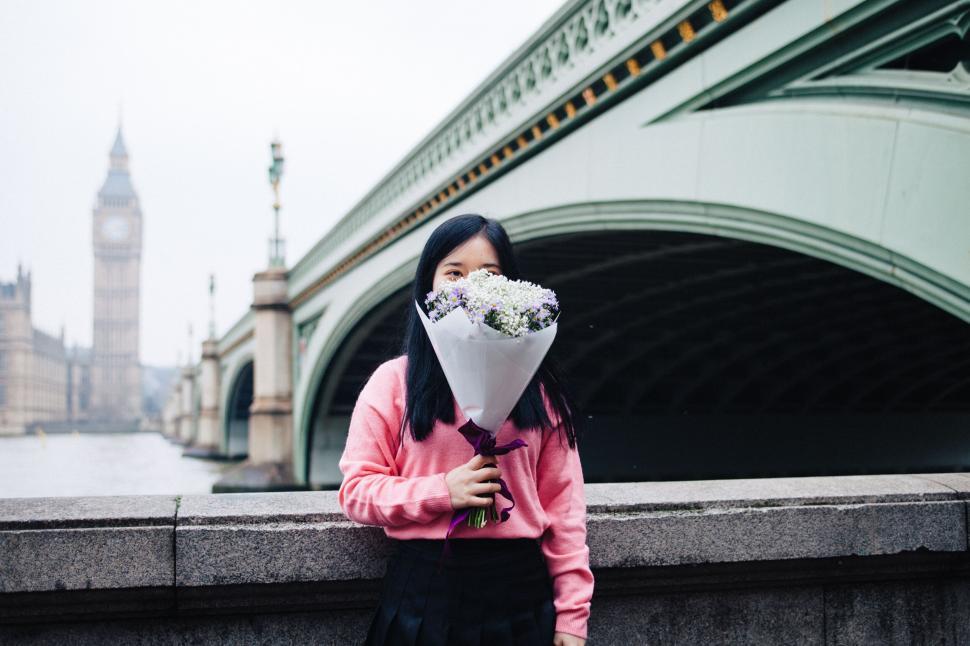 Free Image of Person with flowers in front of Big Ben 