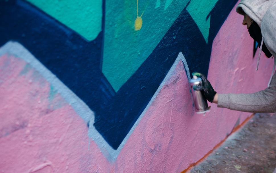 Free Image of Graffiti artist spraying a wall 