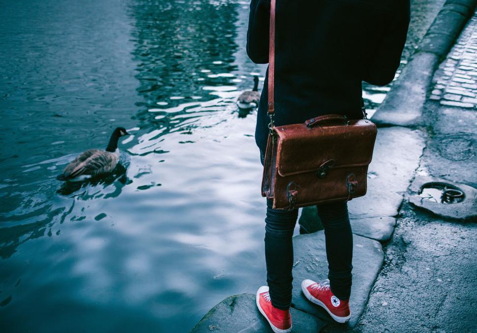 Free Image of Casual style person by the water 