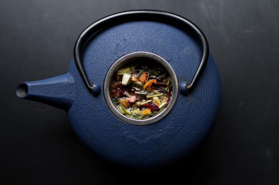 Free Image of Fresh herbal tea in blue teapot on black 