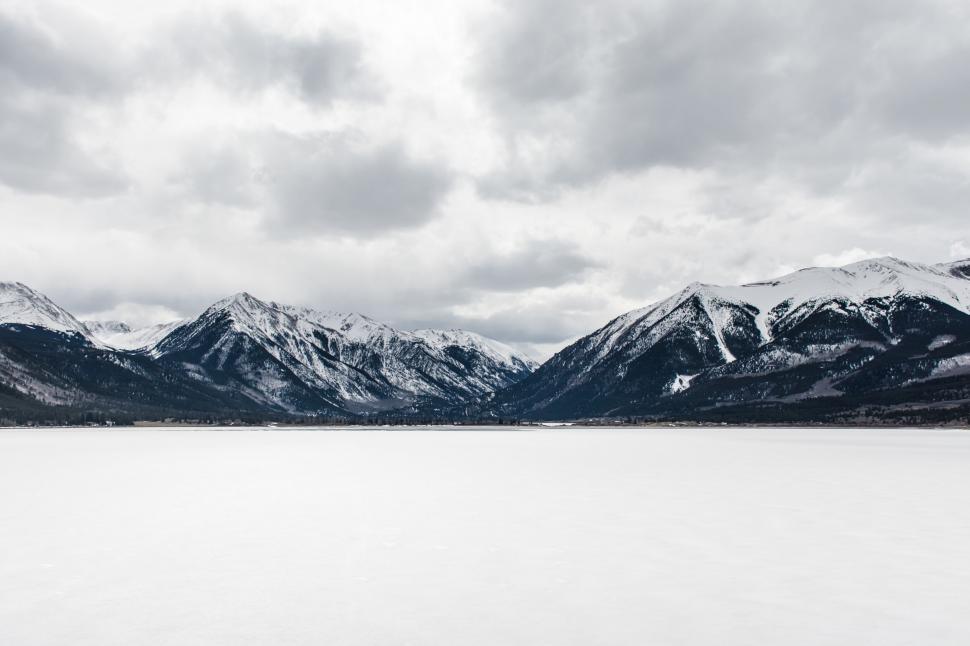 Free Image of Serene winter landscape with frozen lake 