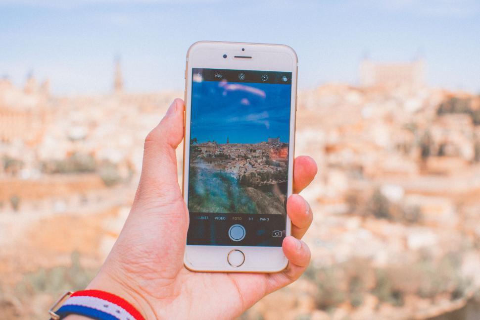 Free Image of Smartphone capturing a cityscape on screen 
