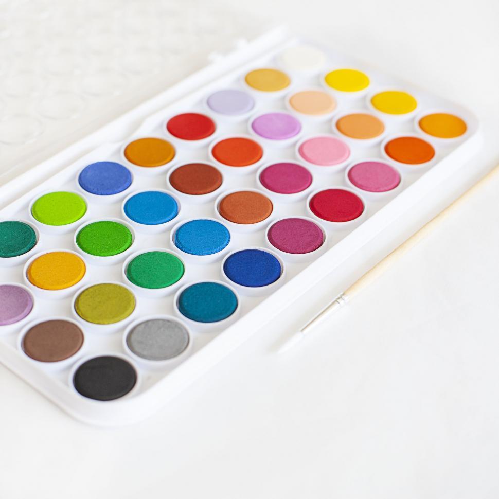 Free Image of Vibrant watercolor paint set on white background 