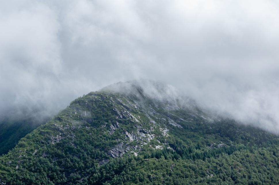 Free Image of Mountain Shrouded in Mist and Clouds 