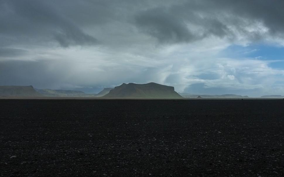 Free Image of Mysterious mountains under a stormy sky 