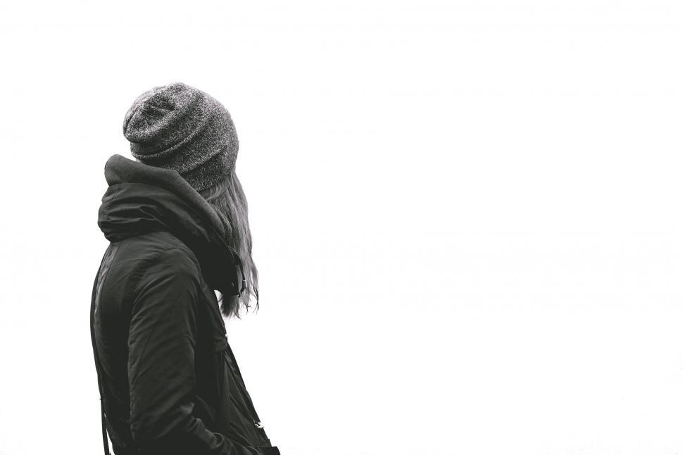 Free Image of Woman in Knit Hat Looking Away from Camera 