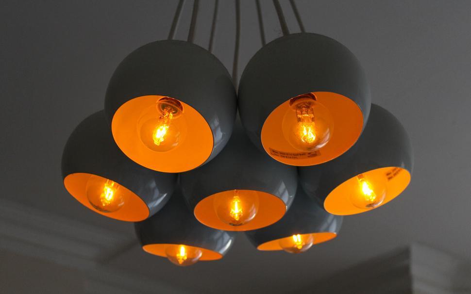 Free Image of Modern gray pendant lights with warm glow 