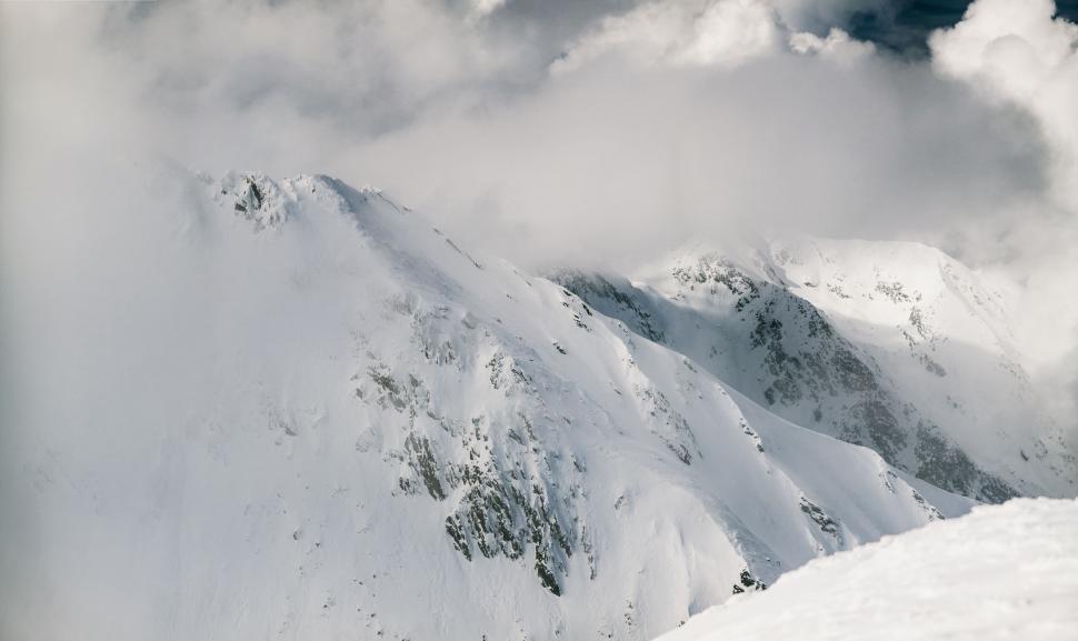 Free Image of Majestic snow-capped mountain and clouds 