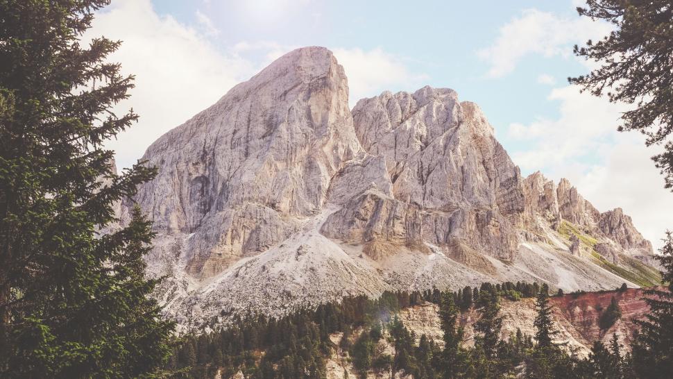 Free Image of Majestic mountain peak with forest framing 