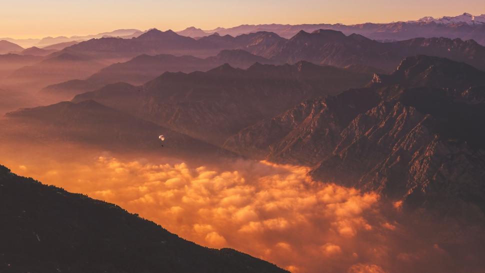 Free Image of Mountains bathed in golden sunset light 