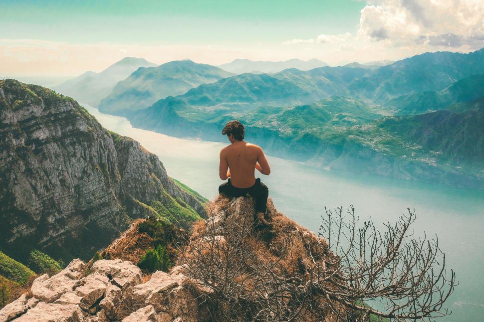Free Image of Shirtless man overlooking mountain range 