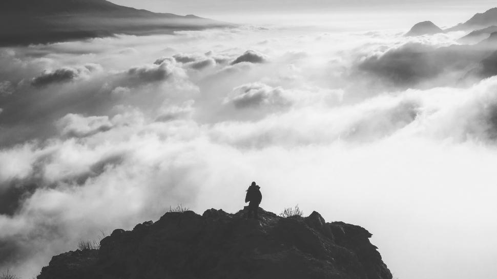 Free Image of Silhouette on a mountain in mist 