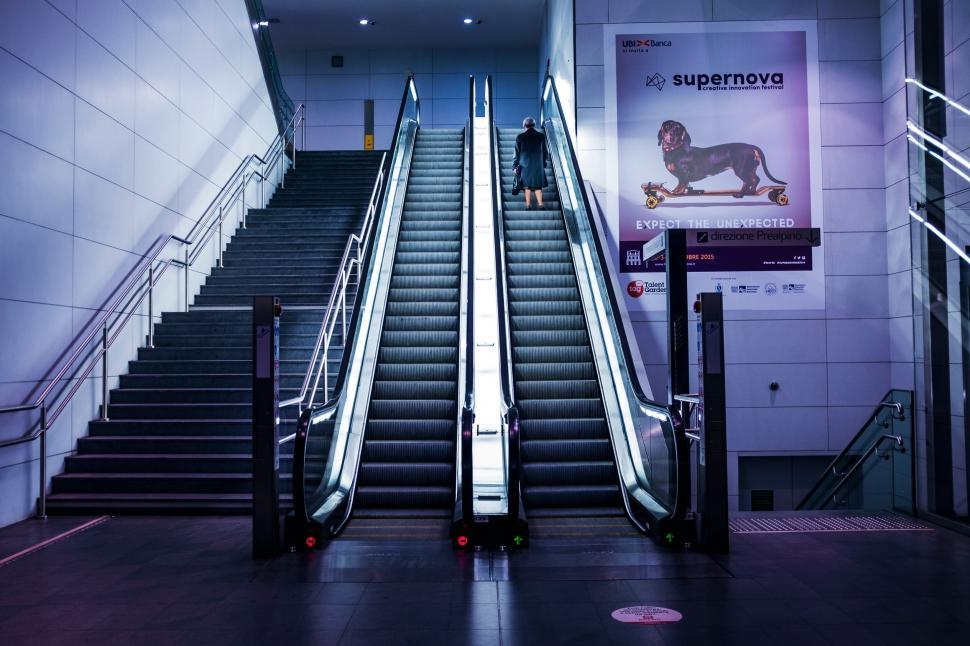 Free Image of Escalator and person in a modern setting 