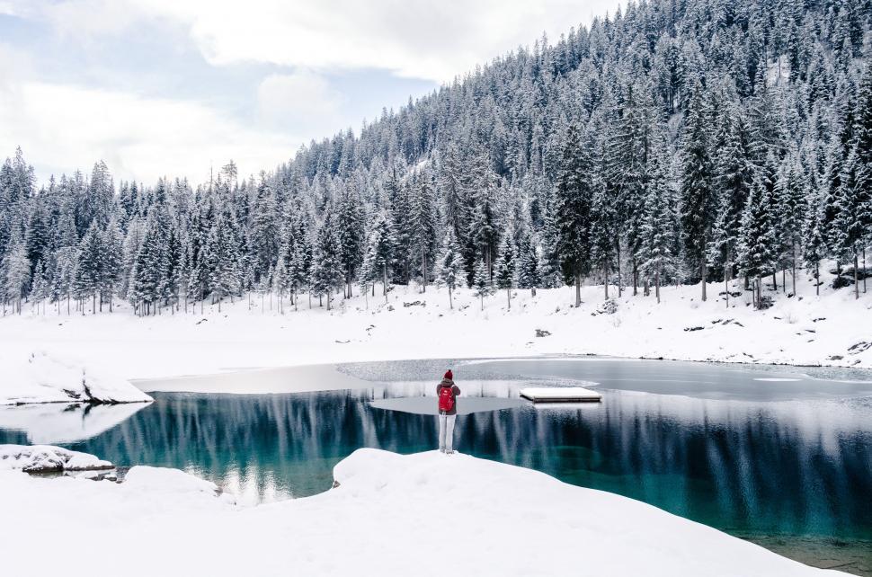 Free Image of Person overlooking serene snowy lake scene 