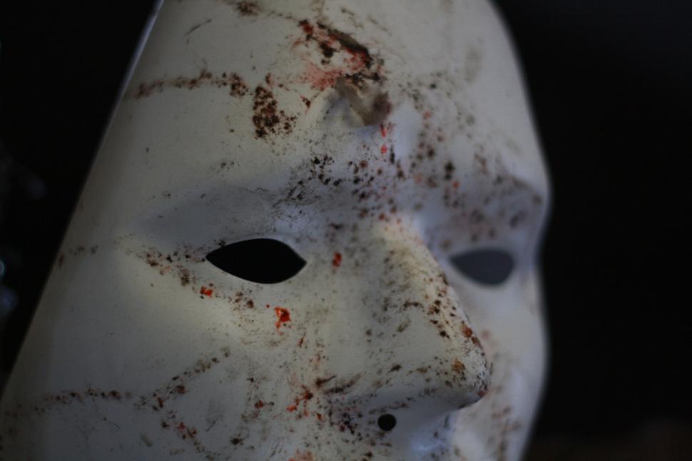 Free Image of Bloodied and dirty white mask close-up 
